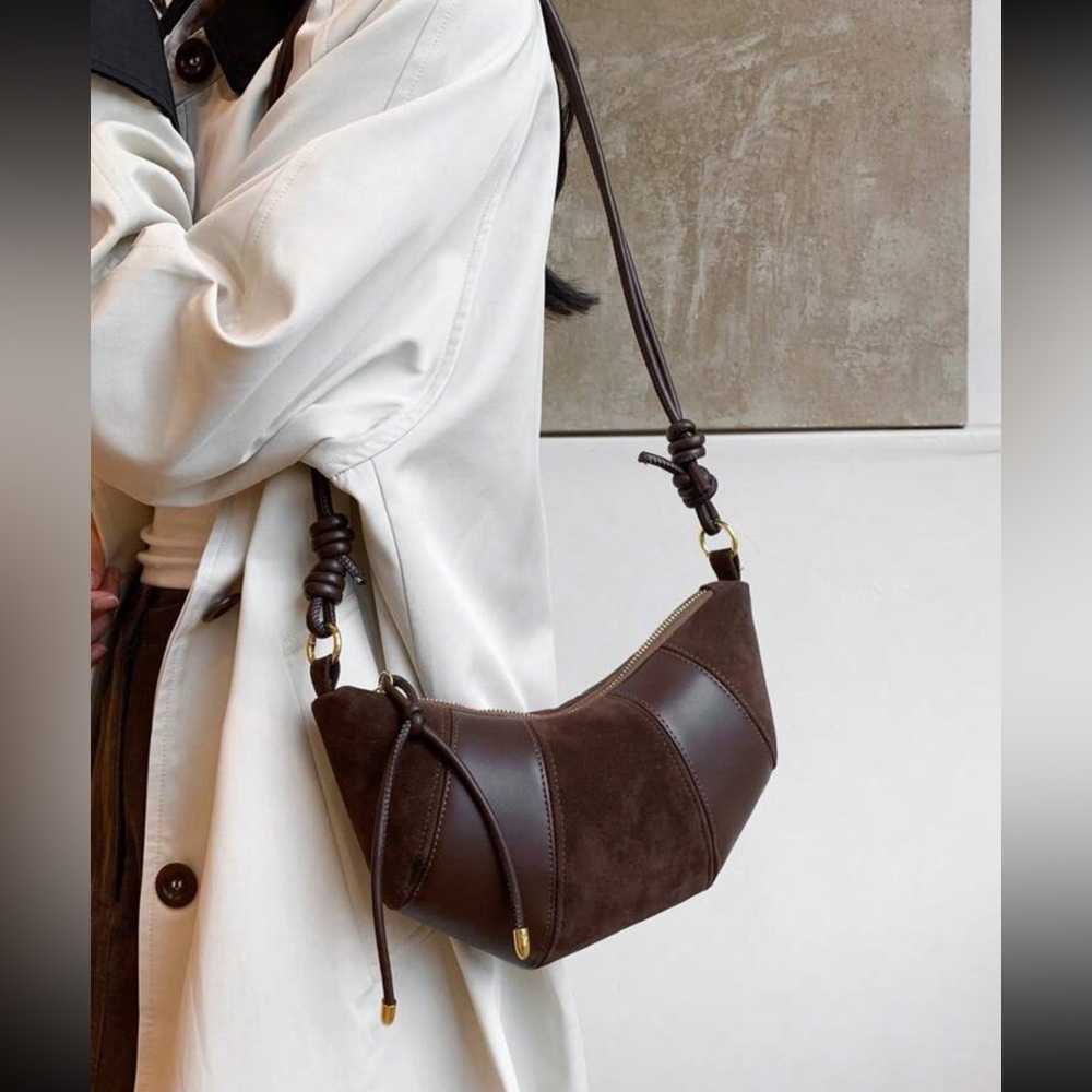 Selling this brown leathered & sued bag
Brand new